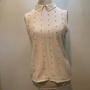 Off white sleeveless top with rhinestones